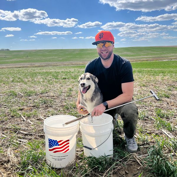 Taking soil samples at the farm with Chevy.