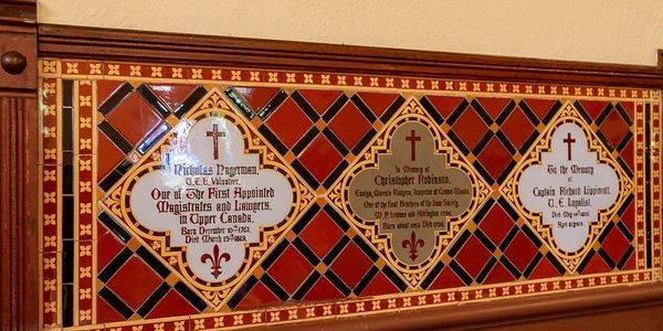 tapestry with prayers inlaid on diamond-shaped frame
