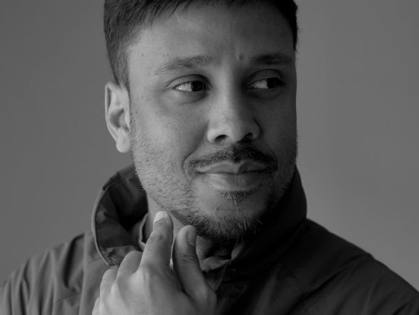 Black and white portrait of a man looking to the side.