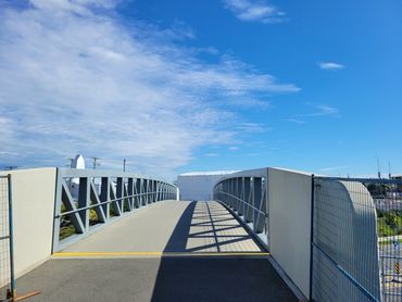 A new walking and biking bridge to access Victoria as you step or ride off the train