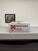 Match brand cigar box and framed photo on shelf.
