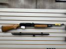 Shotgun disassembled into two parts.