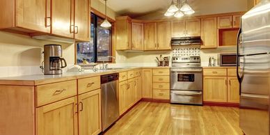 clean and shiny kitchen, polished stainless steel appliances, pot-construction cleaning service | Th