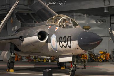 Military aircraft with number 630 in a hangar.
