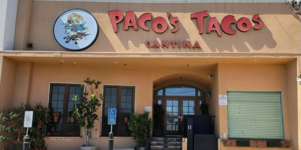 Front view of Paco's Tacos Cantina with signage.