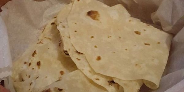 Close-up of stacked flatbreads.
