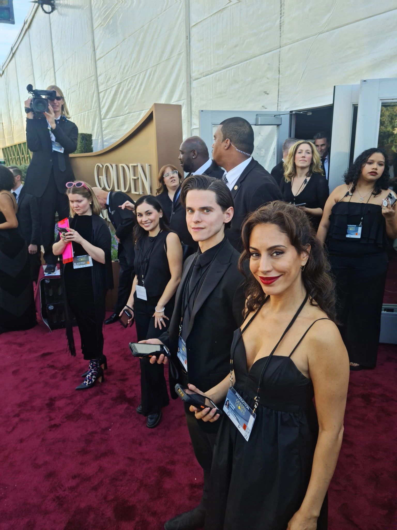 DMC Staff members managing the red carpet at the 2026 Golden Globe Awards.
