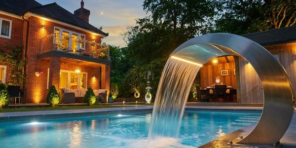 Modern In-Ground Pool with Stone surround. A sleek, heated in-ground pool featuring slip-resistant L