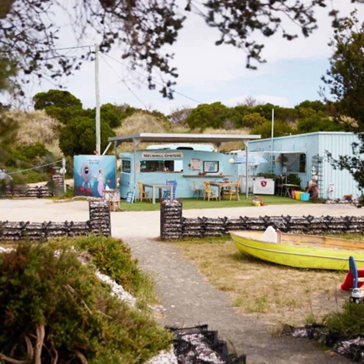 A funky blue van is the backdrop of Melshell Oyster Shack where to buy fresh seafood including oyste