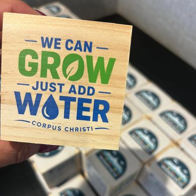 Wooden block with motivational gardening message.