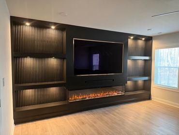 Custom Media Wall with LED puck lighting and 3-sided fireplace