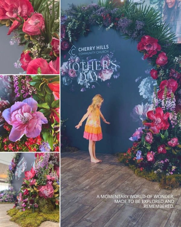 A young girl explores a vibrant floral arch at Cherry Hills Community Church's Mother's Day event.