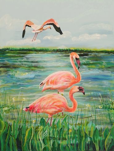 Three flamingos