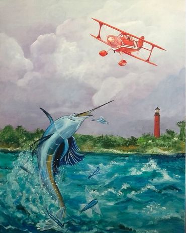 Pitts Special biplane, leaping sailfish chasing flying fish, and Jupiter Lighthouse