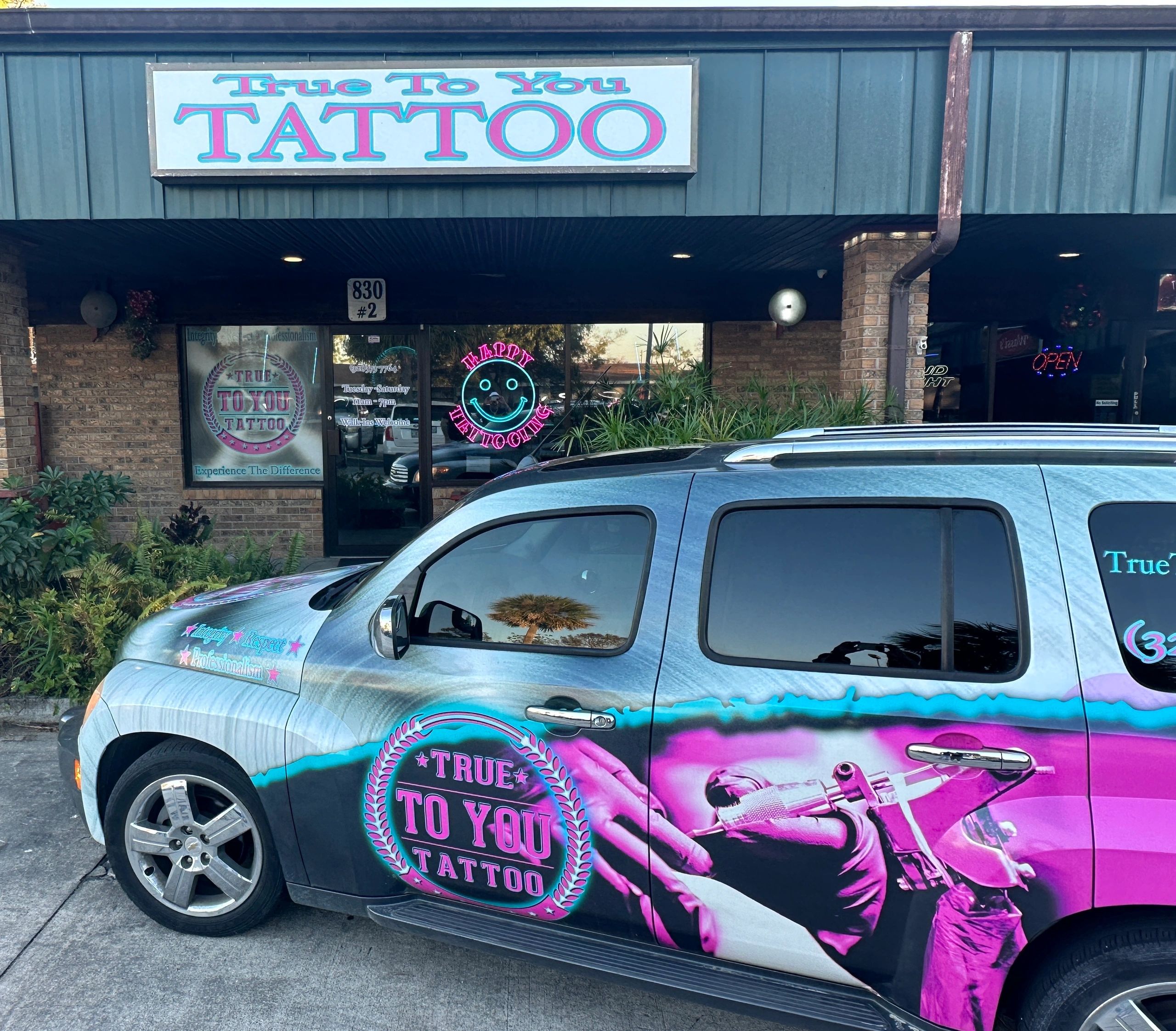 Front of True To You Tattoo studio with the True To You Tattoo Car !