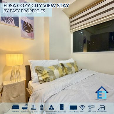Bright bedroom with balcony view in Urban Deca Towers EDSA Mandaluyong.