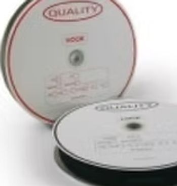 Two reels of blank optical discs, one standing and one lying flat.