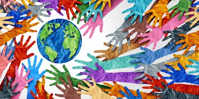 a stock photo image of hands around the world all of different colors.