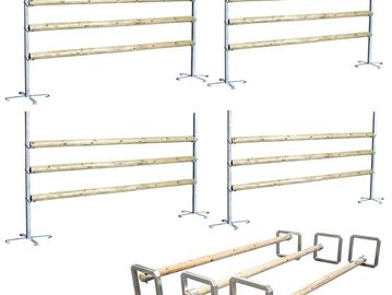 Set of adjustable wooden bars with metal stands.