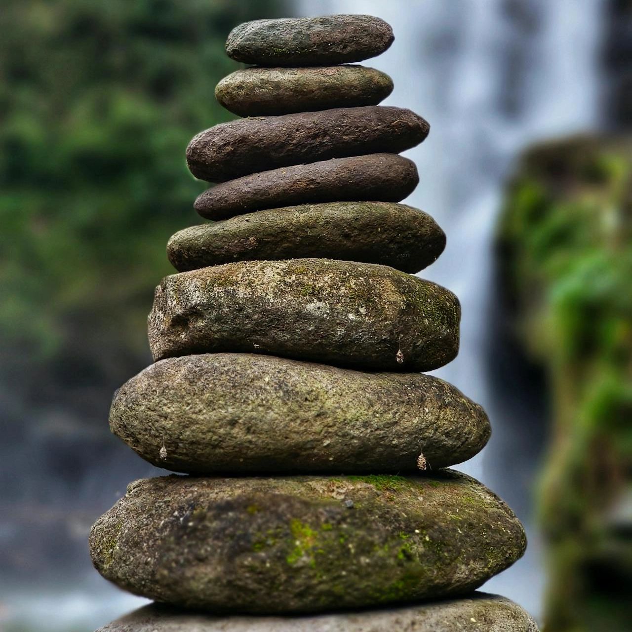 Stack of balanced stones in a natural setting.