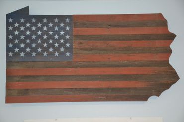 Custom Pensylvania-shaped flag built from reclaimed barn wood