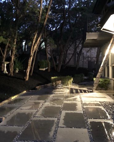 Limestone paver patio installation, with white gravel and cedar tree trimming, we also added mulch d