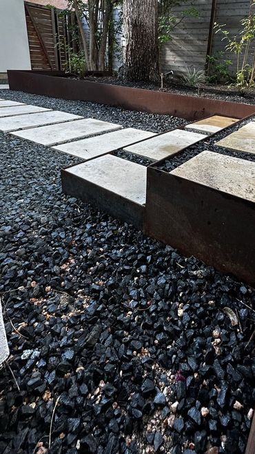 Corten steel flower bed and stairs we did in Zilker neighborhood with limestone pathway and patio