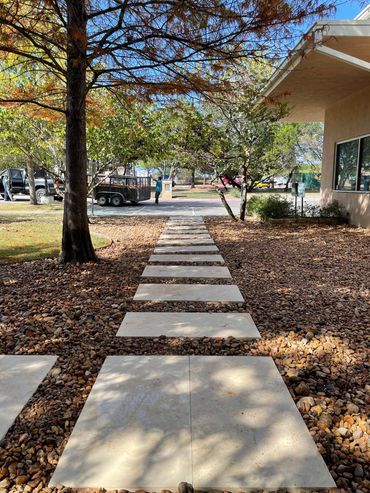 Limestone paver pathway with beautiful river rock we did in Brodie Ln