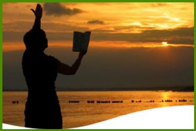 A silhouette of a person by the beach