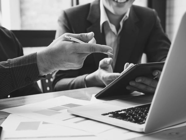 business adviser meeting to analyze and discuss the situation on the financial report