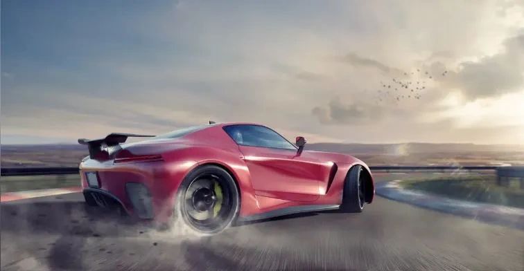 Red exotic vehicle drifting through the bend