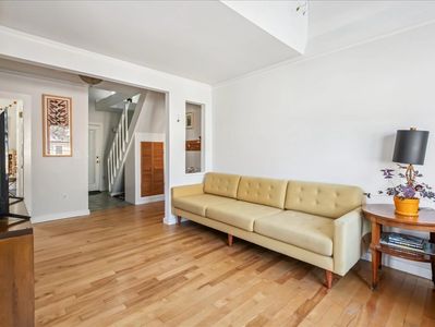 cream colored couch in a white room.