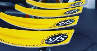 Atlantic Rowing Boat Oars Wrapped in Yellow with the Sponsorship Logos Applied.