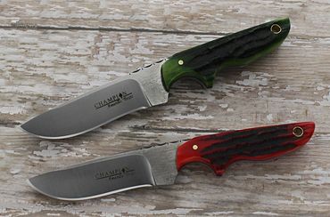 Two Baby Snowcat knives with green and red carved bone handles and mill finish blades by Robert Cham