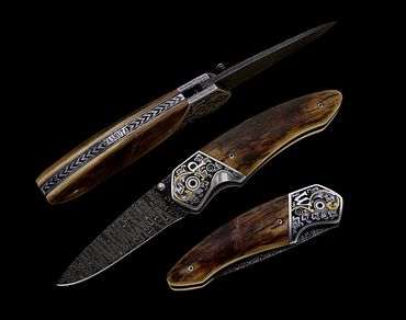 Lone Star folder knife with 24K gold inlay and engraving by Robert Champion