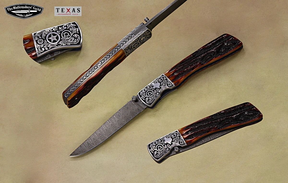 Panhandle Slim folder knife with Texas themed engraving by Robert Champion