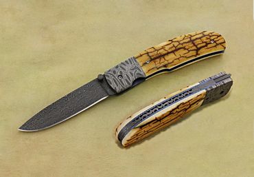Texas Wind folder knife with stainless Damascus blade by Robert Champion