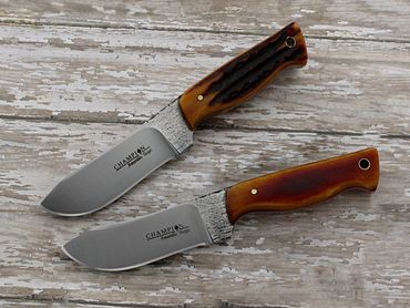 Two Pecos knives with amber bone handles and hand rubbed finished blades by Robert Champion