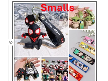 Various themed keychains featuring superheroes, Star Wars, and anime characters.