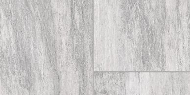 Close-up of gray textured floor tiles.