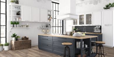 Modern kitchen with island and stools.