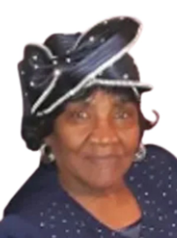 Elderly woman wearing a decorated black hat and dark attire.