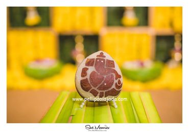 Pellipoolajada_KobbariKudukalu_Kurnool: Carved dry coconut with Lord Ganesh carved