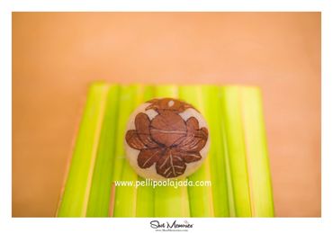 Pellipoolajada_KobbariKudukalu_Mumbai: Carved dry coconut with flower crafted