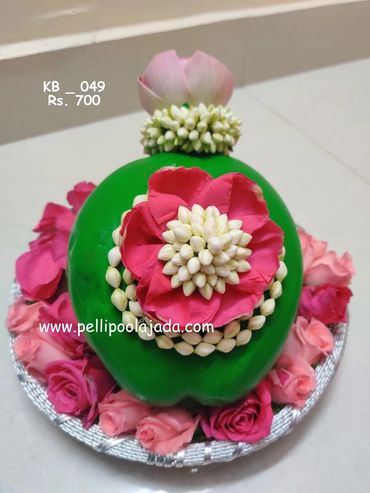 Pellipoolajada_KobbariBondam_Warangal: KobbariBondam design with mallepoovu and lotus  petals
