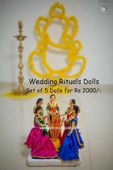 Pellipoolajada_WeddingDolls_Tirupati: Wedding dolls representing pasupu danchadam/pounding turmeric