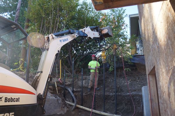 We use our excavators to lift the hammers, so we can drive multiple piles at one time.