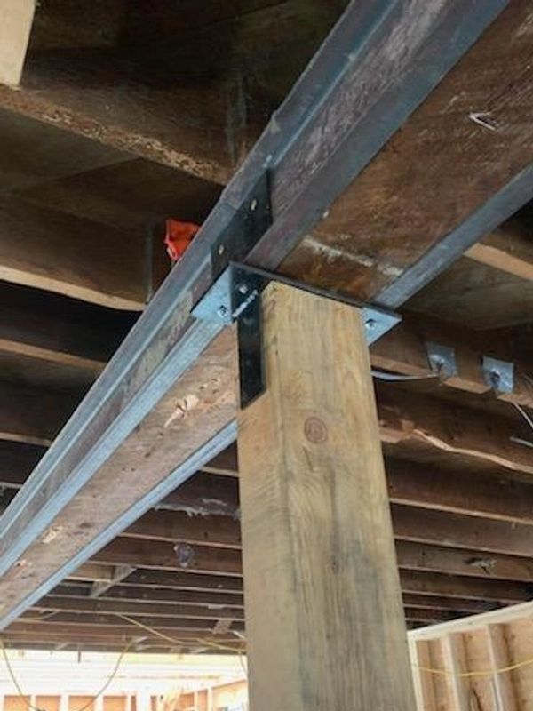 Custom brackets and steel reinforcing of beams