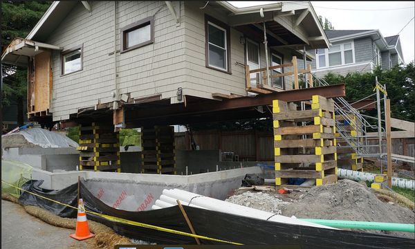 Single story house lifted for new foundation