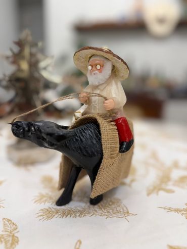 Pinoy Santa riding a Carabao